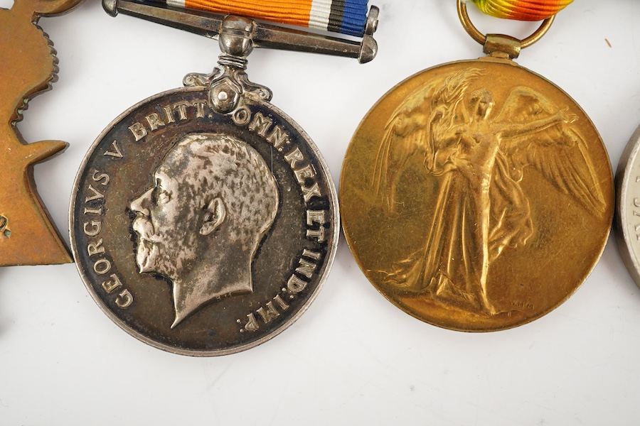 A medal group comprising of a Meritorious Service medal, a 1939 to 1945 Defence Medal, and a First World War trio awarded to 3824 SJT. F.W.G. Wakefield. R.F.A., together with a Delhi Durbar Medal 1911, crudely engraved t